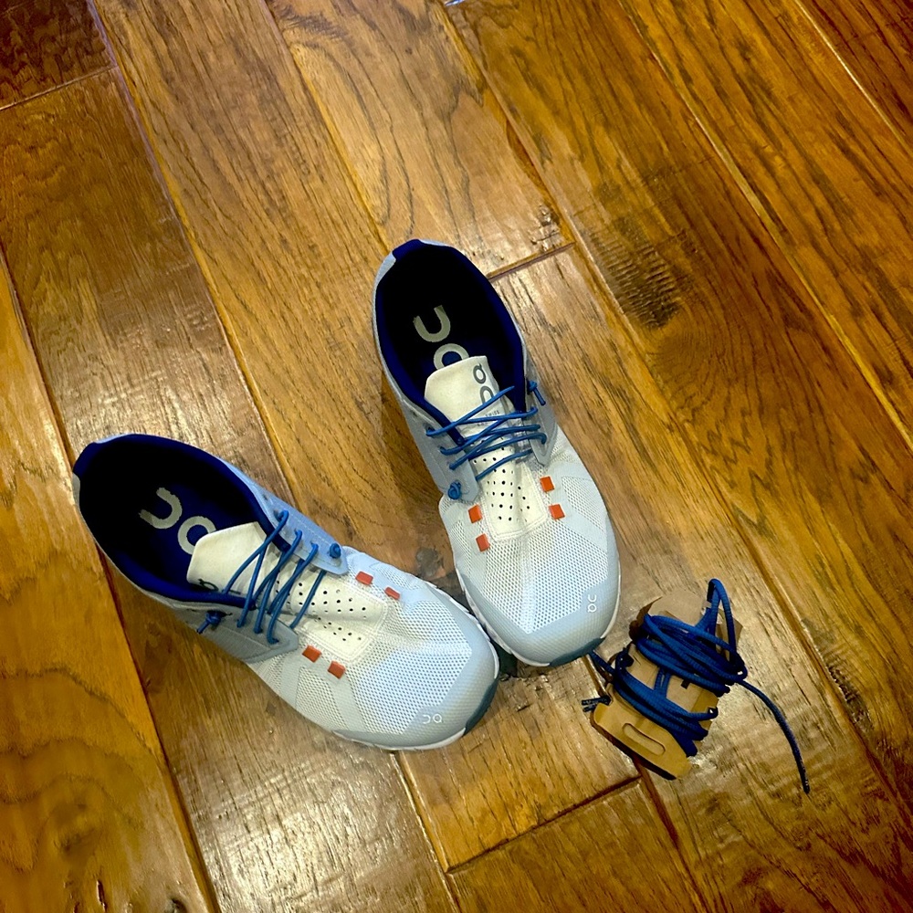 On cloud tennis shoes. Orange, Blue and gray.